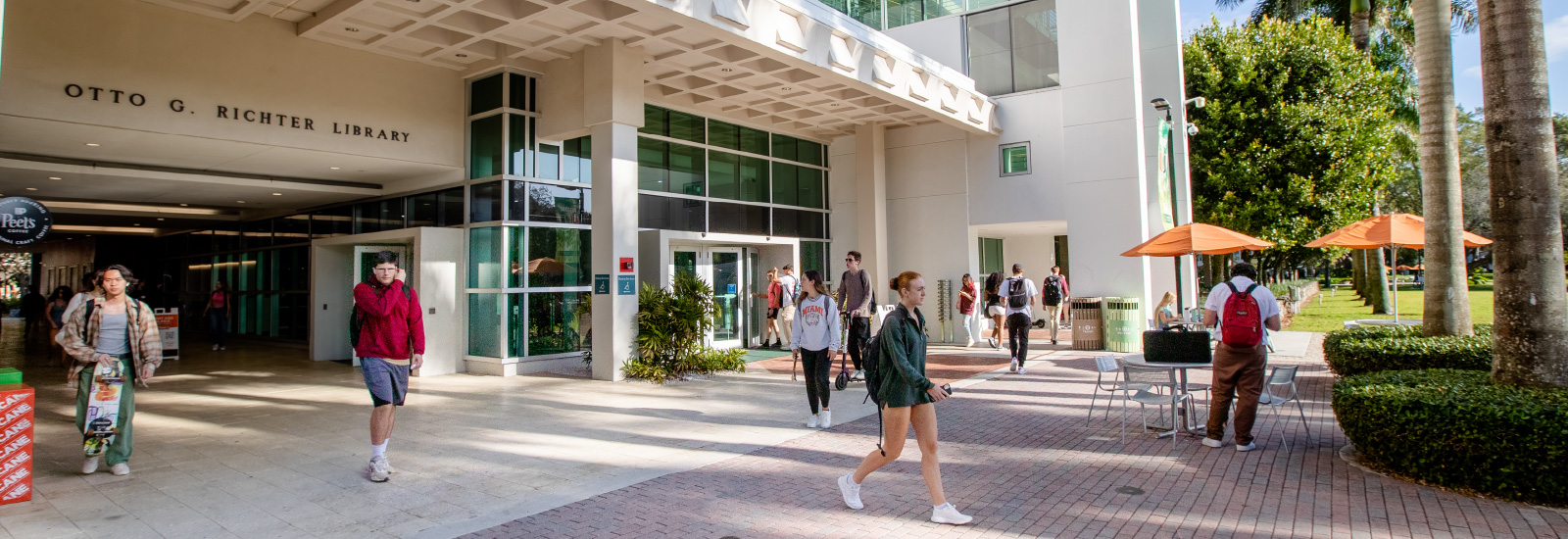 Students walking in front of the Richter Library.