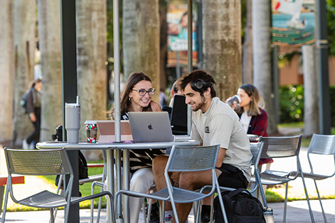 Two students sitting.